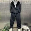 Conjunto esportivo casual de moda outono e inverno, jaqueta solta e calça comprida de marca da moda para homens, conjunto versátil de duas peças para casais e jovens