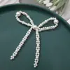 Estilo coreano simple asimétrico lazo de perlas DIY tejido a mano clip para el pelo de cuentas accesorios para el cabello pendientes material al por mayor