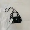 Bolso de mano de nicho Shuai Mi Jia para mujer, nuevo modelo de principios de otoño 2026, moderno y exquisito, adecuado para ir al trabajo, bolso de hombro y cruzado