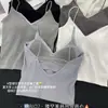 Camisola de moda para mujer con espalda descubierta calada y hermosa, top de tubo de encaje de deseo puro para mujer con copas, top sin mangas acanalado versátil, venta al por mayor