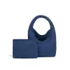 Bolsa de mimbre para cesta de comida versátil de alta gama de moda nueva de principios de primavera, bolso hecho a mano, bolso tipo cubo para llevar al hombro