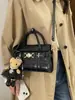 Bolsa de Mão Quadrada Pequena Casual Simples para Mulheres 2026 Nova Moda Primavera Versátil Bolsa de Ombro Transversal de Alta Qualidade