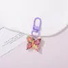 Chaveiro de resina borboleta cor de doce, estilo fofo e doce, pingente feminino, fornecimento para barracas de rua e feiras noturnas, atacado de acessórios de alta qualidade