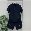 Traje de Verano Nuevo para Hombre de Seda de Hielo de Secado Rápido Moda con Cuello Alto Media Cremallera Manga Corta Pantalones Casuales de Malla Conjunto de Dos Piezas Moderno