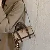 Bolso de mano retro de gamuza estilo coreano para mujer, nuevo bolso cruzado casual Otoño/Invierno 2026, de alta gama y moderno, un popular bolso tote con forma de almohada