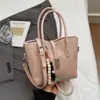 Bolsa Pequena Simples Transfronteiriça para Mulheres Nova Primavera 2026 Vintage Versátil Bolsa de Ombro para o Dia a Dia Bolsa Transversal de Nicho