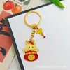 Llavero Colgante Año Nuevo 2026 Metal Zodiaco León Dorado Petardo Despertar Bolsa de la Fortuna Colgante Evento Pequeño Regalo