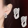 Temperamento coreano aretes de corazón de plata 925 aretes mujer chapados en platino simples de amor aretes venta al por mayor