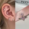 Novo Produto de Primavera Unha de Osso de Orelha com Laço Aço Titânio Unha de Orelha Rosa Zircônio Unha Cochlear Versátil para Mulheres