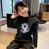 Capa base térmica de forro polar para niños 2026 Otoño/Invierno Nuevo estilo Camiseta versátil de manga larga para niños Camiseta interior de cuello semi-alto para niños