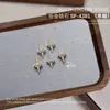 Joyería para Uñas Starburst Aleación Circonita Montón Diamante Alas Colgante Estrella Cuatro Picos Diamante Accesorios Decoraciones para Uñas