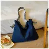 Bolsos de mezclilla al por mayor para exportación, nuevos diseños elegantes para mujer, gran capacidad, adecuados para el trabajo, se pueden llevar debajo del brazo o como bolso de hombro