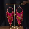 Joyas populares europeas y americanas fuente transfronteriza estilo étnico bohemio retro pendientes largos de borla de cuentas de arroz para mujer