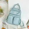2025 Nova Mochila Escolar Multicompartimentos de Grande Capacidade para Aluno do Ensino Fundamental Estilo Coreano Versátil Mochila Casual Simples