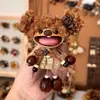 Encantador perrito peludo con la lengua fuera, llavero para bolso, colgante de dibujos animados natural, semillas de terapia de sonido curativas, popular en zonas escénicas, amuleto divertido y adorable