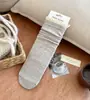 Meias de renda com babados de comprimento médio para outono e inverno no atacado, meias femininas de cor sólida estilo faculdade japonesa