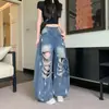 Comercio transfronterizo primavera mujer estampado de letras chica popular pantalones largos de pierna ancha jeans rotos con diseño único de salpicaduras de tinta y lavado vintage