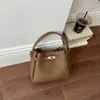 Bolsa balde retrô de nicho estilo coreano transfronteiriça para mulheres, nova bolsa de ombro casual versátil 2026, bolsa de mão, bolsa transversal