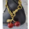 Directo de fábrica bolsa de cereza colgante de bolsa cerezas llavero creativo decoración de coche llavero venta al por mayor transfronteriza mujeres