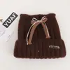 Gorro de punto de mezcla de lana de alta calidad con un lazo y orejas de gato, diseñado para mujeres, perfecto para otoño e invierno, proporcionando calidez y protección para los oídos, y haciendo que el rostro parezca más pequeño
