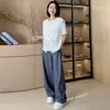 Camiseta top de moda de dos piezas falsas con mangas cortas retorcidas, nuevo diseño de verano 2026, corte holgado, adelgazante y favorecedor