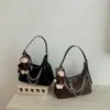 Bolsa Feminina de Axila 2026 Nova Bolsa Dumpling de Outono High-End Retrô Exquisita para o Dia a Dia Bolsa de Ombro Único Bolsa Transversal