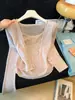 Otoño temprano 2026 nuevo cárdigan de moda estilo deseo puro estilo coreano con top de punto tipo cover-up con camisola conjunto de dos piezas de color liso para mujer