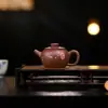 Tetera de Arcilla Púrpura de Pequeña Capacidad Yixing al por Mayor para Uso Doméstico, Hecha de Arcilla Púrpura Original, Tetera de Arcilla Púrpura Juelunzhu Semimanual