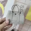 Nuevo Colgante de Mini Bolsa de Jardín Marca H Lindo Accesorio de Bolsa para Auriculares Cadena de Bolsa para Labiales de Microfibra Canasta de Verduras para Mujeres