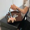Bolsa de Mão Kelly de Couro Genuíno de Alta Qualidade para Mulheres 2025 Nova Bolsa de Ombro Transversal de Nicho para o Dia a Dia Bolsa de Moda
