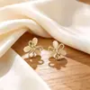 Aretes de botón florales frescos y delicados estilo bosque para mujer, estilo vacacional, aretes de perlas/joyería para orejas de lujo ligero de nicho de alta gama