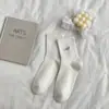 Nuevos calcetines de tubo de color liso con bordado de corazón pequeño, estilo académico básico, versátiles para niños, calcetines académicos para mujer