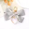 Nuevo Colgante Creativo de Cadena Colgante con Lazo de Perlas para Bolso, Funda de Teléfono, Llavero, Adorno, Exquisito Accesorio de Regalo Pequeño