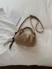 Bolso pequeño cuadrado de gamuza con textura retro transfronterizo para mujer, nuevo bolso versátil y elegante para el hombro y cruzado de 2026