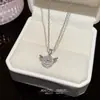 Elegante Collar de Corazón Palpitante con Alas de Ángel para Mujer, Lujo Ligero, Gama Alta, Versátil, Exquisito, Estilo Celebridad de Internet, Cadena para Clavícula de Acero de Titanio