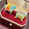 Tienda de Oro Mismo Estilo Colgante Antiguo de Esmalte Dorado Flor de Durazno con Diseño de Caballo, Nuevo Estilo Chino Colgante de Caballo del Zodiaco