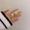 Brincos Elegantes Flor de Camélia de Luxo Leve Feminino Design de Nicho Celebridade da Internet de Alta Qualidade Novos Brincos da Moda 2021 Brincos