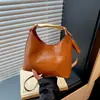 Bolso Sencillo de Media Luna para Axila Elegante Bolso de Mujer 2026 Principios de Otoño Nuevo Estilo Moda Tendencia Color Sólido Bolso de Mano para el Trabajo Bolso de Hombro