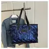 Bolsa de gran capacidad para chaqueta de plumón para mujer 2025 Nueva Otoño e Invierno Versátil Ins Nicho Bolso de mano Bolso tote de moda