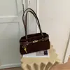 Bolsa de ombro de nicho transfronteiriça com design de fivela de cinto, novo modelo 2026, textura de linho, bolsa baguette para o dia a dia