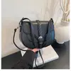 Bolso pequeño vintage 2026 nueva moda bolso de hombro de alta gama para debajo del brazo elegante versátil bandolera tipo silla de montar