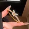 Pulsera de oro real de 18K chapado con cierre de nudo de circonita, sensación de lujo ligero de alta gama, joyería de mujer moderna versátil y a la moda