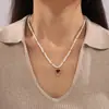 Hepburn Estilo Novo Estilo Pêssego Conjunto de Coração Pingente de Zircão Titânio Aço Banhado a Ouro Corda Imitação de Pérola Design Colar Fresco e Simples para Mulheres