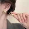 Pendientes Metálicos Lisos Plateados con Forma de Frijol 2026 Nuevo Diseño de Nicho Elegantes Estilo Coreano Pendientes para el Trabajo al por Mayor