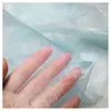 Oferta especial al por mayor tela de organza 100% poliéster color liso hilo de seda brillante hilo de vidrio tela delgada suave hilo decorativo