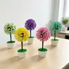 Nuevas plantas artificiales en maceta con diseño de cielo estrellado y flor de cerezo, perfectas para la decoración del hogar, creando una exhibición creativa y mejorando el ambiente de un restaurante