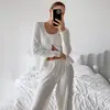 Marca independente tricô vazado elástico jacquard cardigã de abotoamento simples roupa de casa pijama conjunto de calça longa e manga longa estilo europeu e americano