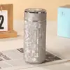 Copo isolado de titânio puro de alta qualidade e esteticamente agradável com design de camada dupla, apresentando um mecanismo de separação de água e chá e um display de temperatura mecânico, perfeito como presente corporativo ou para preparar chá.
