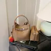 Bolso Cubo Versátil de Nicho Súper Popular Estilo Coreano 2026 Nuevo Bolso de Hombro Cruzado de Moda Casual para el Trabajo