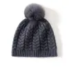 Venta al por mayor de fábrica Cachemira Transfronterizo Otoño e Invierno Nuevo Tejido de Punto Grueso con Trenzas y Pompón Protector contra el Frío Cálido Gorro de Punto